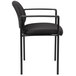 A Boss Diamond Black stacking chair with arms and black cushion.