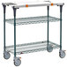 A Metro PrepMate MultiStation cart with wheels and a white surface.