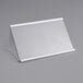 A white plastic lid with a clear cover.
