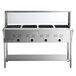 A stainless steel ServIt electric steam table with sneeze guard and undershelf holding four pans.