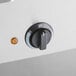 A close-up of a dial on a ServIt electric steam table.