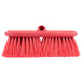 A Carlisle red brush with long bristles.