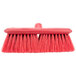 A Carlisle Sparta red brush with long bristles.