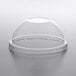 A clear plastic dome lid on a clear plastic cup.