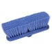 A close-up of a Carlisle blue wall cleaning brush with bristles.