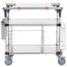 A stainless steel cart with shelves on wheels.