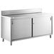A Regency stainless steel work table with enclosed base and sliding doors.