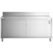 A Regency stainless steel work table with sliding doors on an enclosed base.