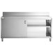 A Regency stainless steel cabinet with sliding doors and shelves on a stainless steel work table.