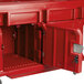 A red plastic container with a door open.