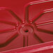 A red plastic Cambro container with a hole in the bottom.