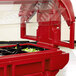 A red Cambro Versa Ultra food container on a counter with salad inside.