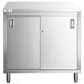 A stainless steel Regency enclosed base table with sliding doors.