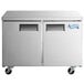 Two large silver Avantco undercounter refrigerators on wheels.