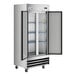 A stainless steel reach-in freezer with two solid doors and interior shelving.