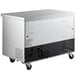 An Avantco stainless steel rectangular undercounter freezer with wheels.