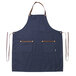 a blue apron with brown straps