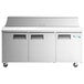 An Avantco stainless steel 3 door refrigerated sandwich prep table on wheels.