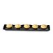 A black rectangular melamine display tray with four cupcakes on it.