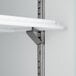 A metal shelf with a metal bracket on a white background.