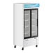 An Avantco white customizable glass door refrigerator on wheels.