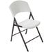 A 4 pack of white Lifetime light duty folding chairs with black legs.