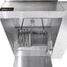 A Halifax commercial kitchen hood with metal pipes and valves inside.