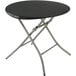 A round black Lifetime folding table with silver legs.