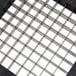 A metal grid with white squares.