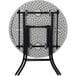 a round white table with black legs