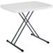A white rectangular Lifetime personal folding table with metal legs.