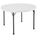 A white round Lifetime plastic folding table.