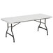 A white rectangular Lifetime plastic folding table with black legs.