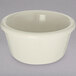 A white bowl on a gray surface.