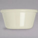 A Carlisle ivory bone melamine ramekin on a white surface.