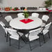 a white chair and a round table