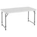 A white rectangular Lifetime plastic folding table with metal legs.