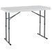 A white rectangular Lifetime plastic folding table with metal legs.