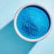 A bowl of Adourne Light Blue Sanding Sugar.