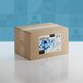 A brown box of Adourne Light Blue Sanding Sugar with a blue and white label.