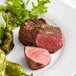 A plate of food with a Warrington Farm Meats filet mignon steak and vegetables.