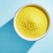 A bowl of Adourne yellow sanding sugar.