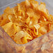 a plastic container full of potato chips