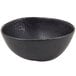 A black bowl with white specks.