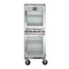 A Beverage-Air stainless steel undercounter refrigerator with two glass doors on wheels.