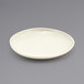 A white Front of the House porcelain plate with a small rim on a gray background.