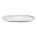An oval white porcelain plate with a slightly raised rim.