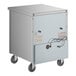 A white True undercounter refrigerator with wheels.