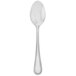 A close-up of a Walco Accolade stainless steel teaspoon with a beaded design on the handle.