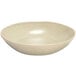 A white bowl with a speckled surface.